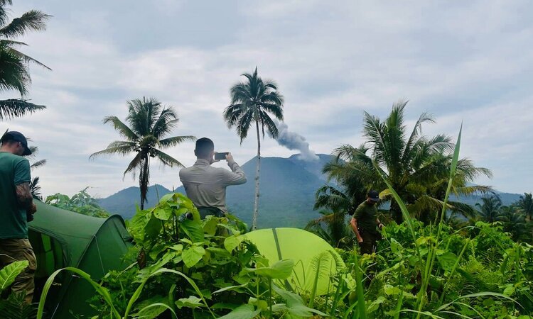 Moluccas, Halmahera: Tent camp with view of Ibu volcano