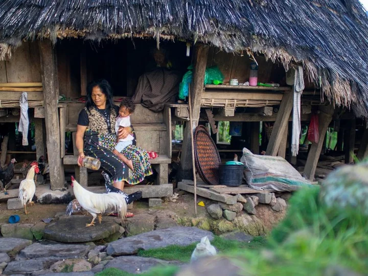  Woman with toddler: Flores' tranquil village life