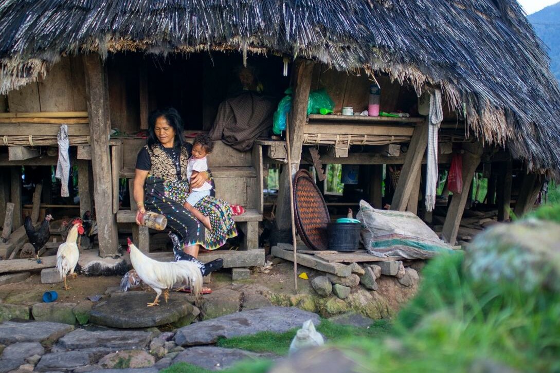  Woman with toddler: Flores' tranquil village life