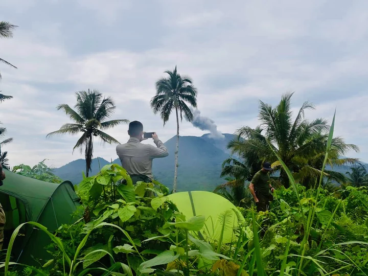 Moluccas, Halmahera: Tent camp with view of Ibu volcano
