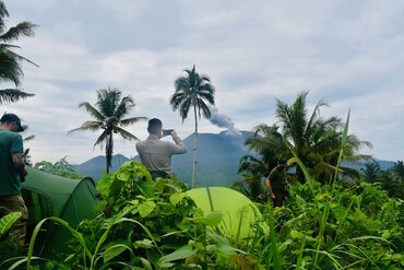 Moluccas, Halmahera: Tent camp with view of Ibu volcano