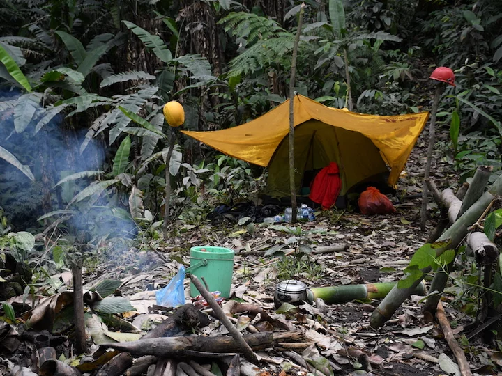 Moluccas, Halmahera: Jungle tent camp with camp fire