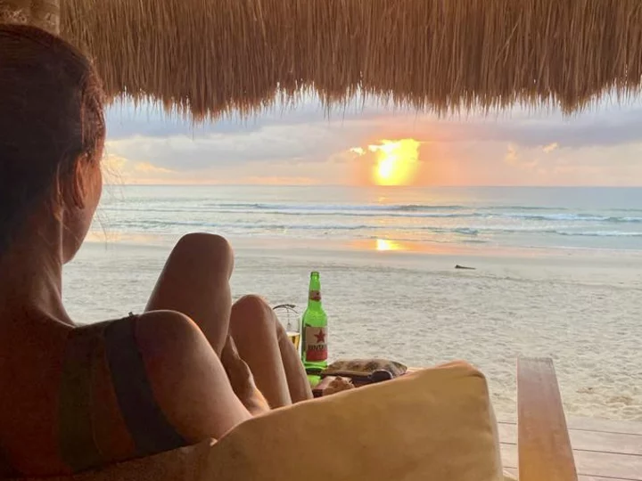  Sumba Beach House, Indonesia: Girl with sundowner at sunset