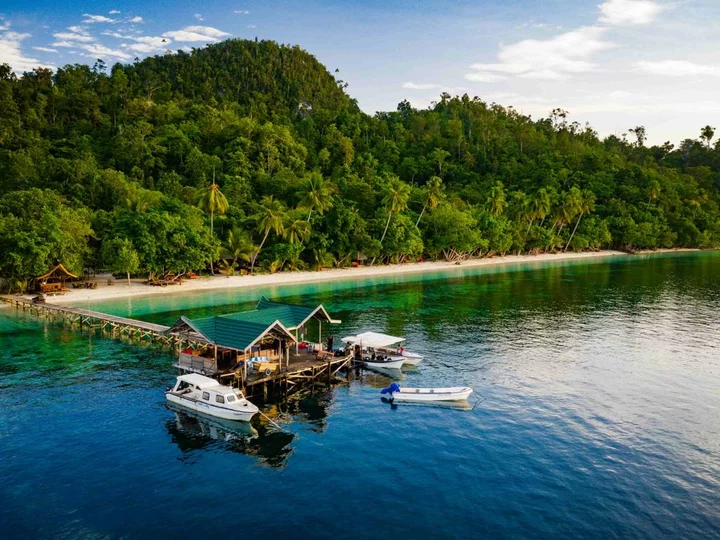  Indonesia, Raja Ampat Biodiversity Nature Resort: Jetty, beach & palm trees