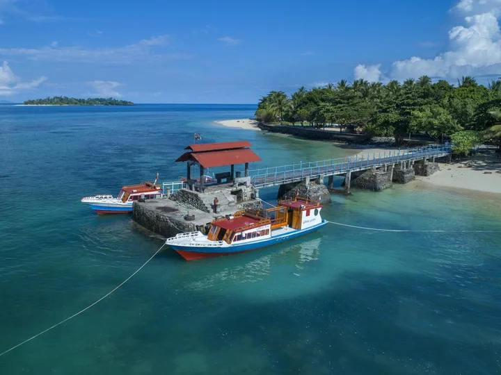 Diving boats at jetty, Gangga Island Resort & Spa