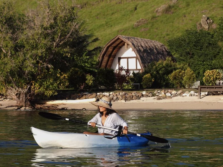 By kayak along the house reef: Komodo Resort, Komodo National Park