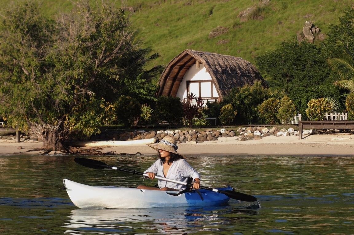 By kayak along the house reef: Komodo Resort, Komodo National Park