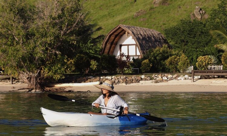 By kayak along the house reef: Komodo Resort, Komodo National Park